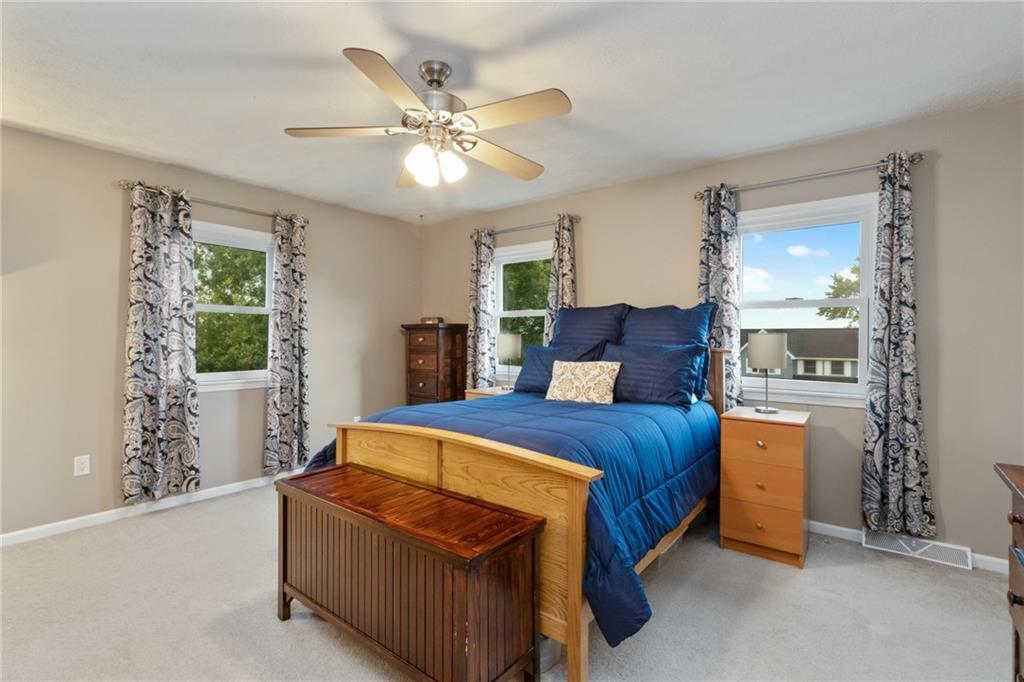 174 Cedar Ridge Drive Monaca, PA 15061 - Photo 12 of 22 A king size accommodating master bedroom features a beautifully updated spa like bath and walk in closet.