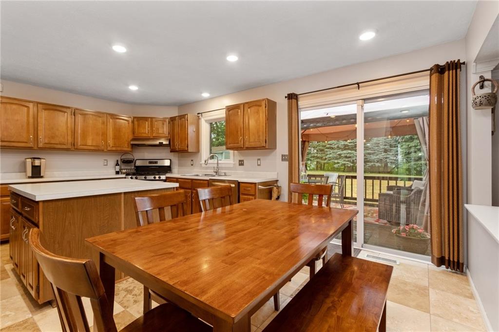 174 Cedar Ridge Drive Monaca, PA 15061 - Photo 6 of 22 Sliding doors offer lots of natural light & an easy transition to an alfresco deck and the fenced rear yard.