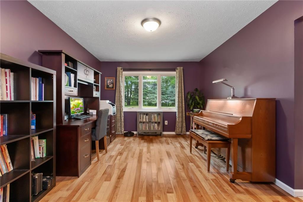 174 Cedar Ridge Drive Monaca, PA 15061 - Photo 9 of 22 Currently used as an office, the dining room boasts beautiful hickory hardwood flooring and full rear yard views.