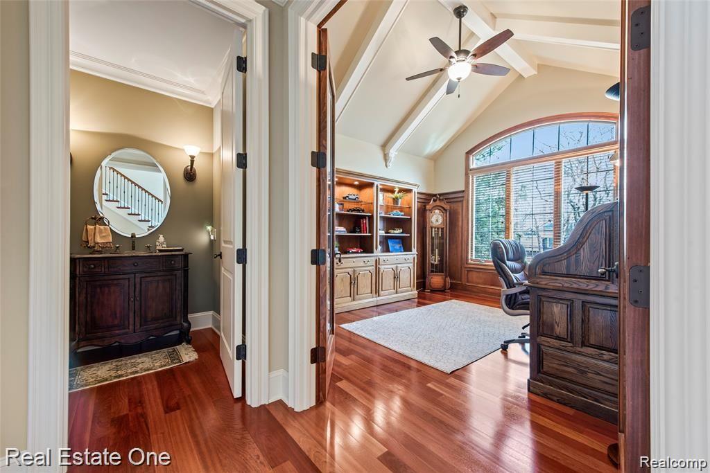 7500 Maple Ridge Drive Clarkston, MI 48346 - Photo 10 of 75 Same view with french doors open. Library ceiling is vaulted and beamed for extra appeal. Transom window to allow loads of natural lighting (UV protection added to front windows and some others where direct sunlight hits)