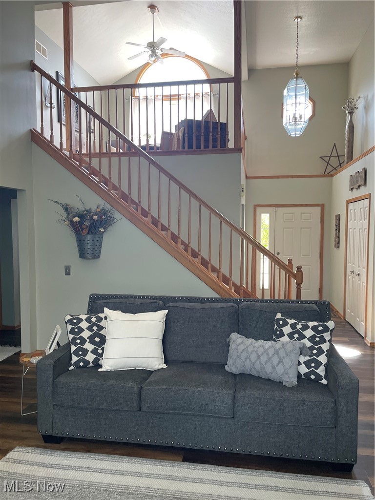 2435 Queensbury Road Alliance, OH 44601 - Photo 5 of 36 Living area with high vaulted ceiling, stairs, dark wood-type flooring, and a ceiling fan