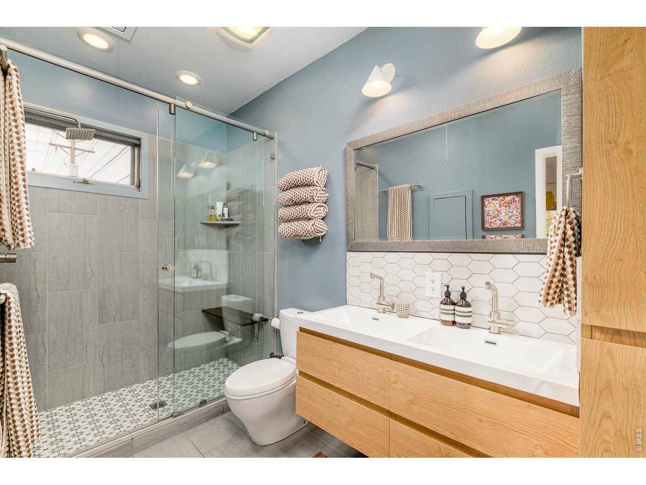 2215 20th Street Boulder, CO 80302 - Photo 20 of 42 a bathroom with a sink a toilet and shower