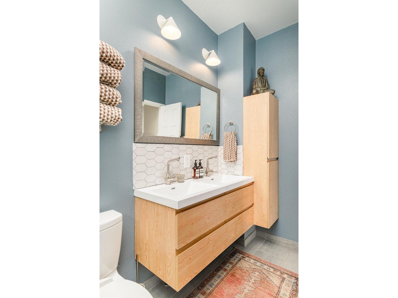 2215 20th Street Boulder, CO 80302 - Photo 22 of 42 a bathroom with a sink and a mirror