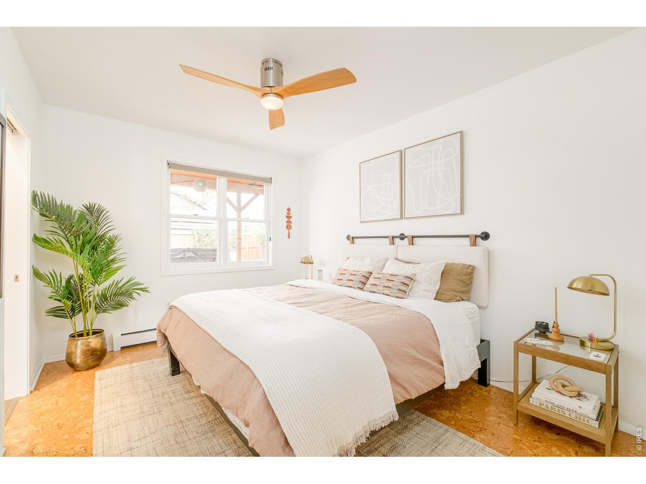 2215 20th Street Boulder, CO 80302 - Photo 25 of 42 a bedroom with a bed and a potted plant