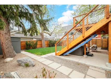 a view of a house with backyard porch and sitting area