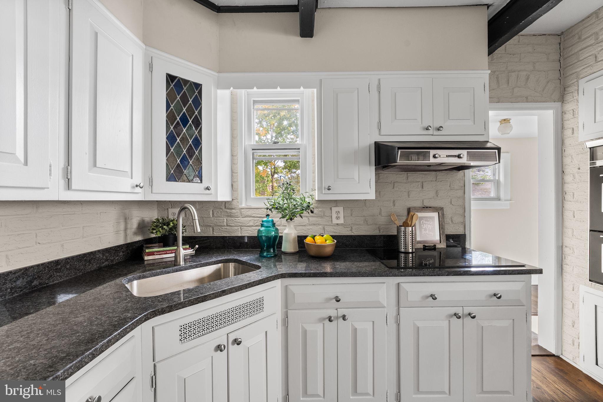 96 Drexel Avenue Lansdowne, PA 19050 - Photo 13 of 58 a kitchen with stainless steel appliances granite countertop white cabinets sink and a granite counter top