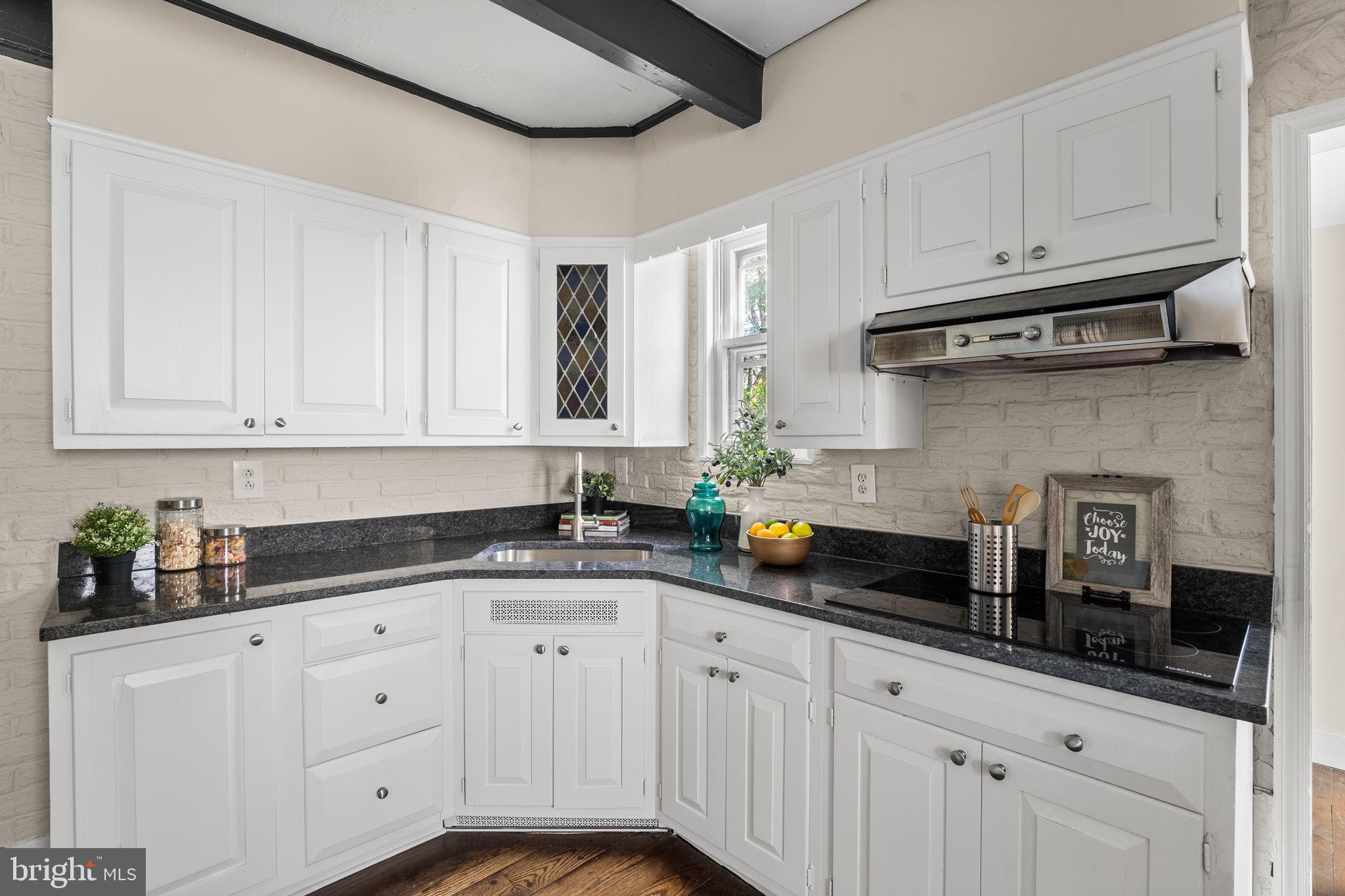 96 Drexel Avenue Lansdowne, PA 19050 - Photo 15 of 58 a kitchen with granite countertop white cabinets and white appliances