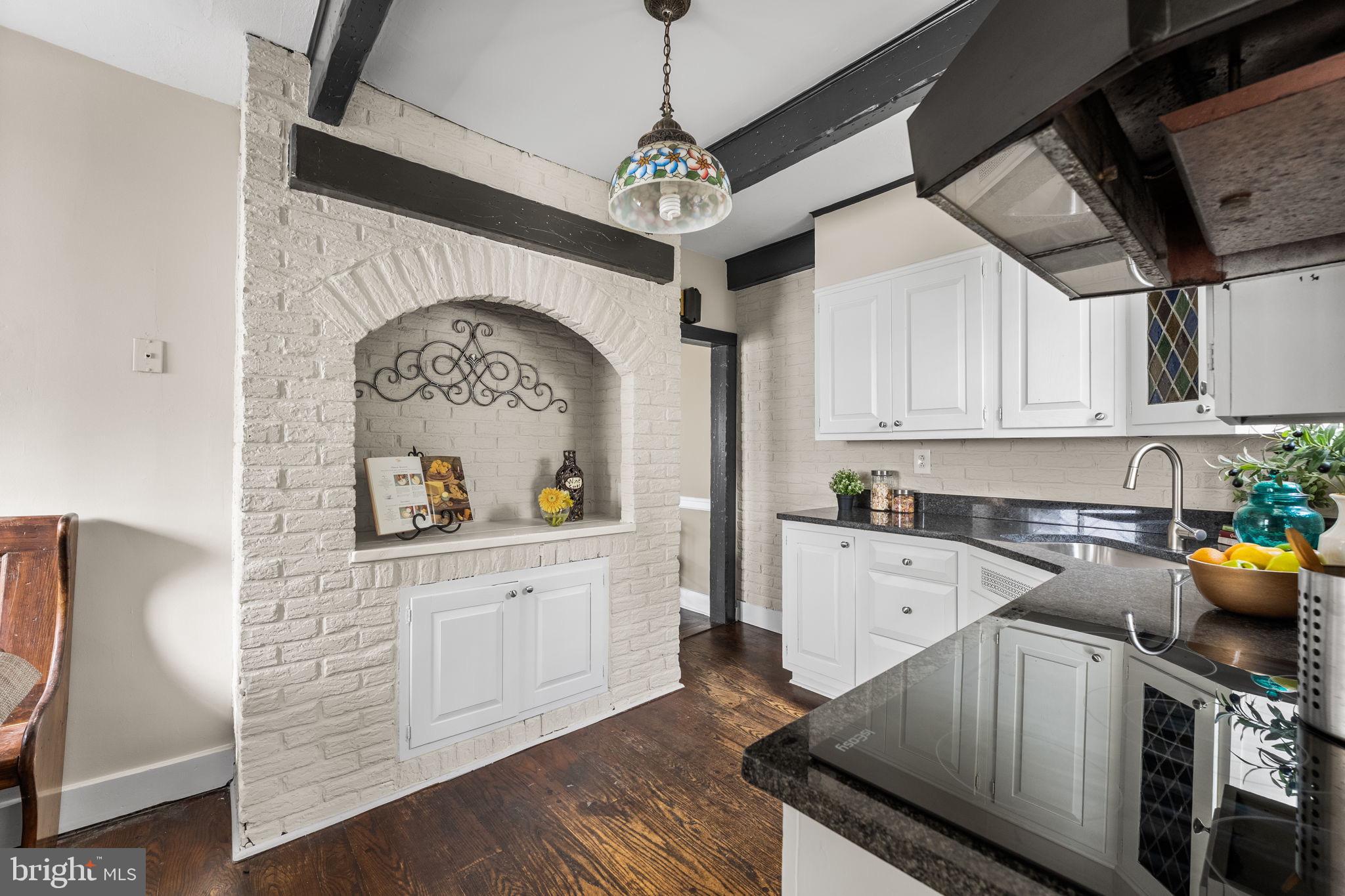 96 Drexel Avenue Lansdowne, PA 19050 - Photo 16 of 58 a kitchen with stainless steel appliances granite countertop a refrigerator a stove and white cabinets with wooden floor