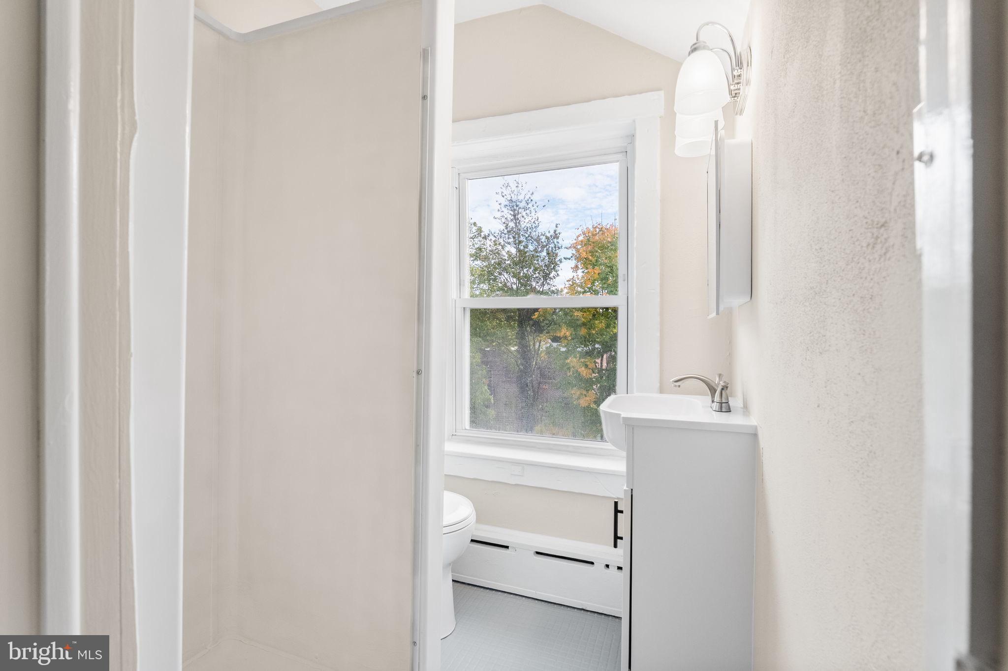 96 Drexel Avenue Lansdowne, PA 19050 - Photo 39 of 58 a bathroom with a toilet sink and window