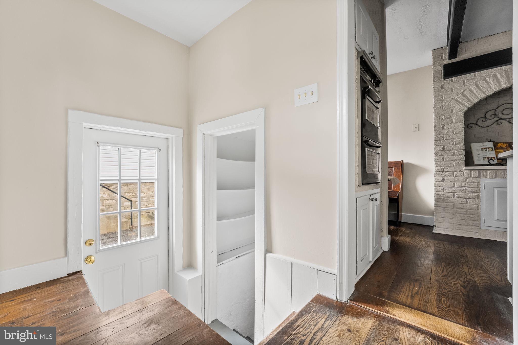 96 Drexel Avenue Lansdowne, PA 19050 - Photo 41 of 58 a view of a hallway with wooden floor and a living room