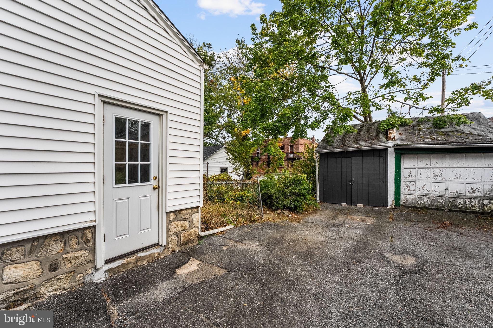 96 Drexel Avenue Lansdowne, PA 19050 - Photo 46 of 58 a view of a house with a yard and garage
