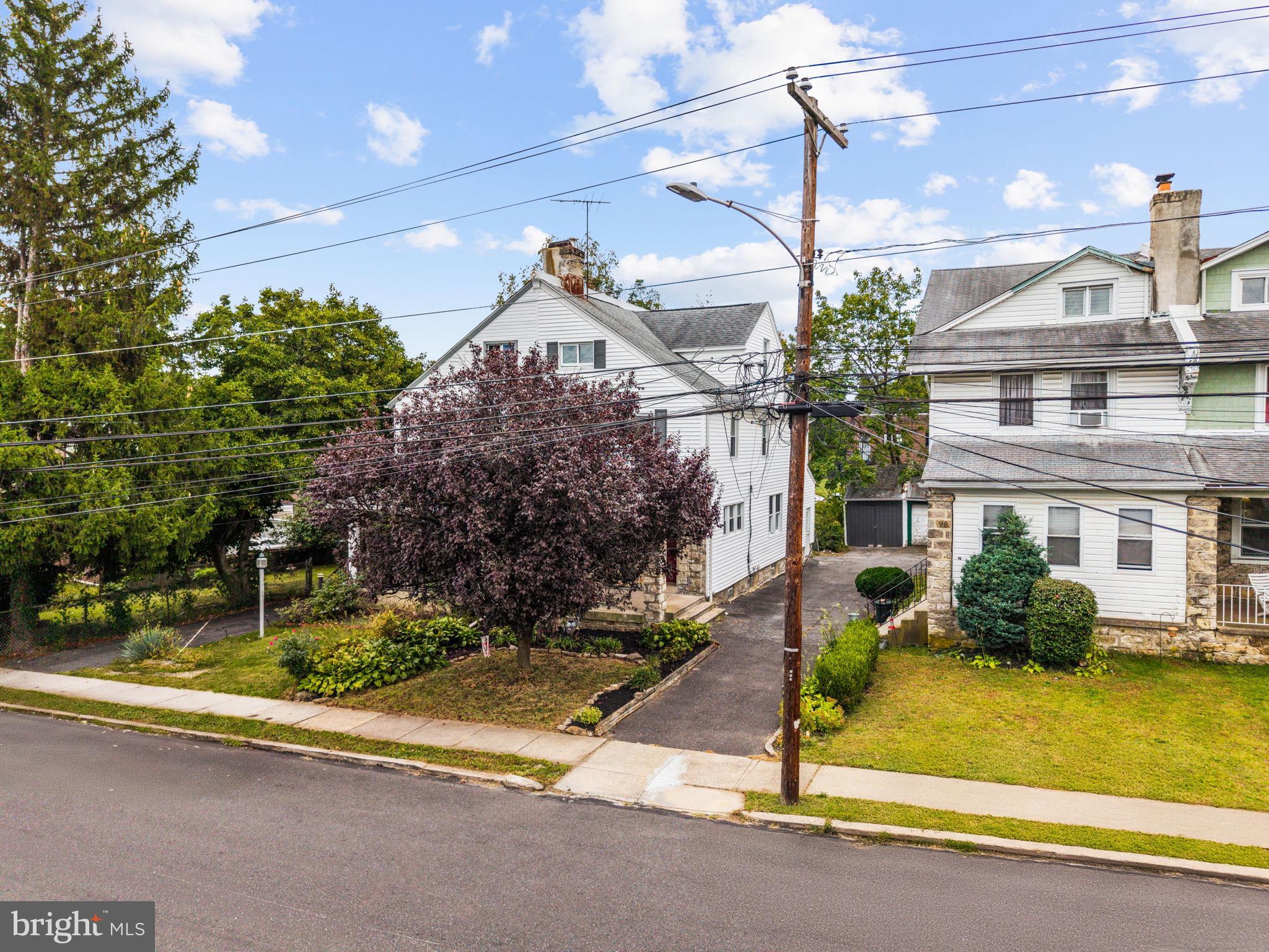 96 Drexel Avenue Lansdowne, PA 19050 - Photo 52 of 58 a front view of a house with garden