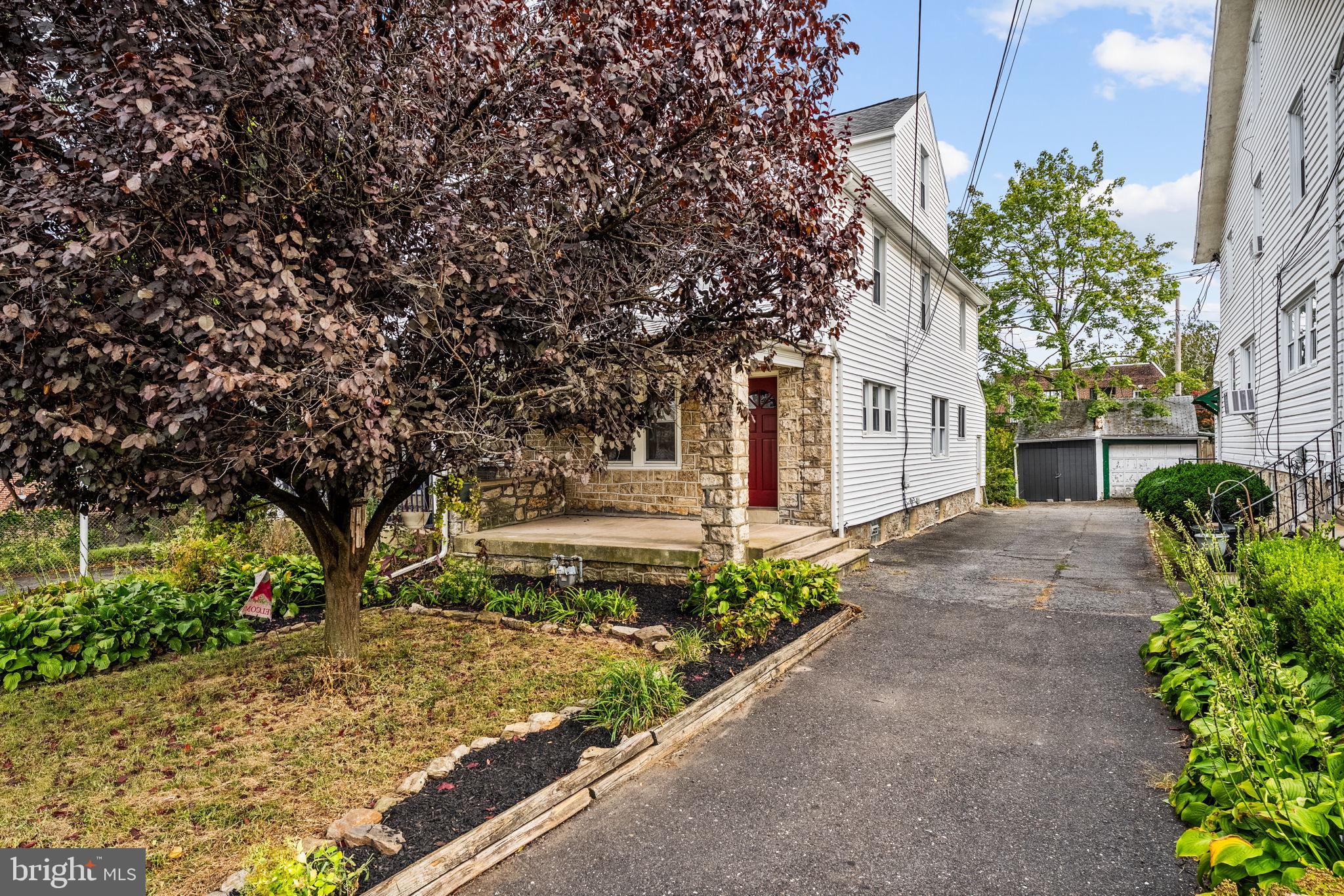 96 Drexel Avenue Lansdowne, PA 19050 - Photo 55 of 58 a front view of a house with garden