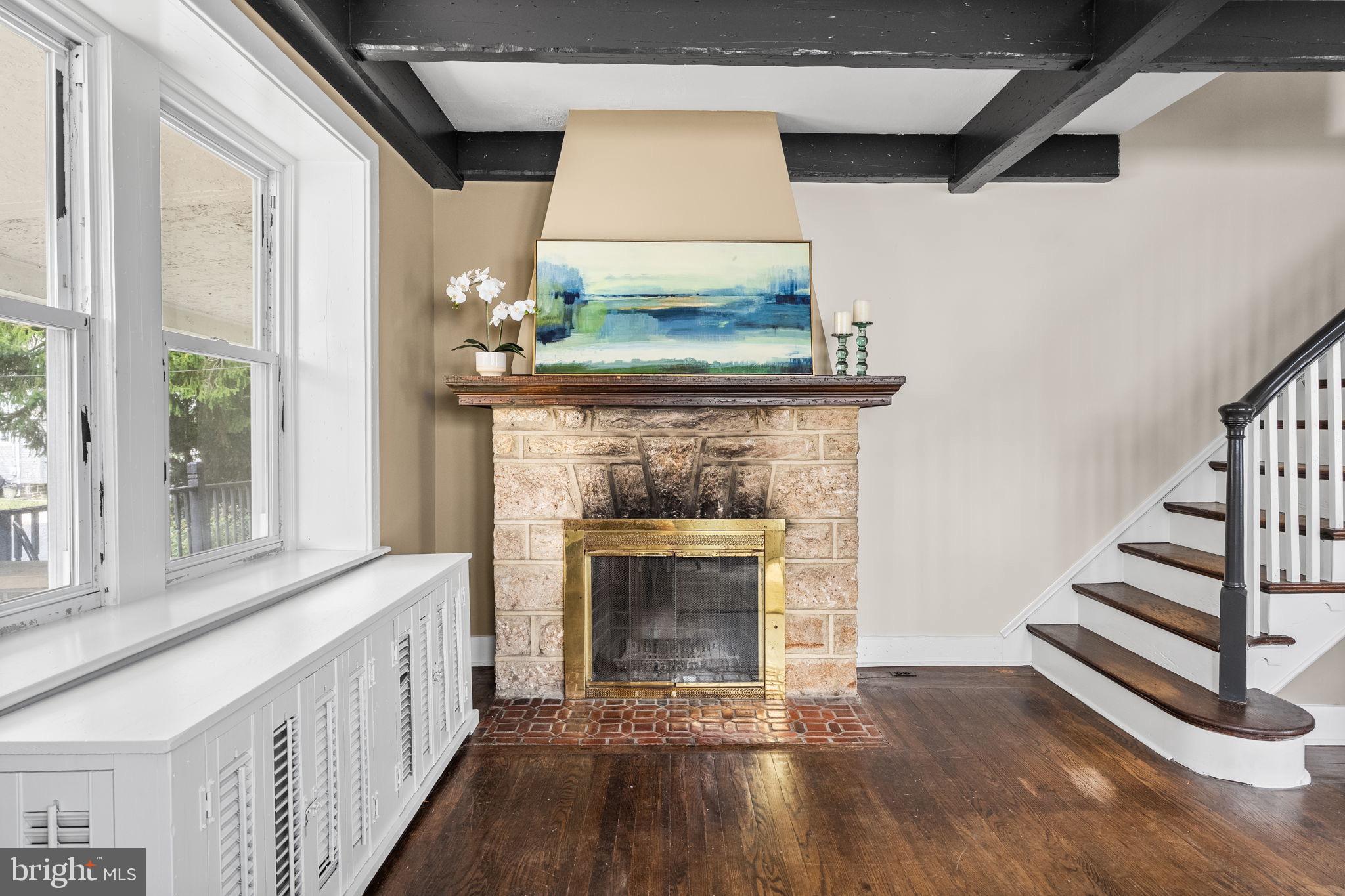 96 Drexel Avenue Lansdowne, PA 19050 - Photo 7 of 58 a view of a livingroom with wooden floor a fireplace and windows