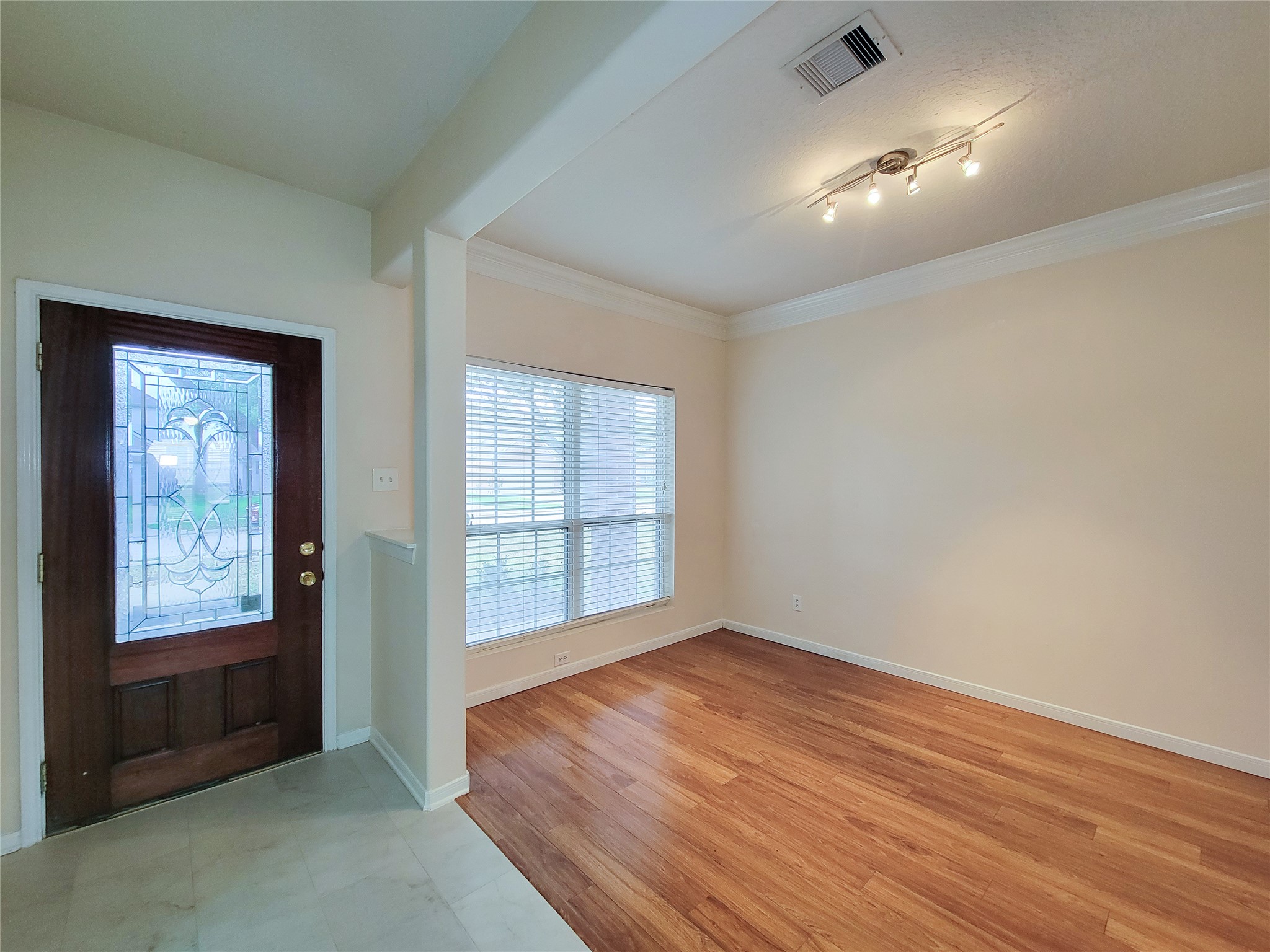19626 Hardwood Ridge Trail Cypress, TX 77429 - Photo 4 of 48 Pretty leaded glass door at the entry. New tile floor & partial view of Formal Dining room.