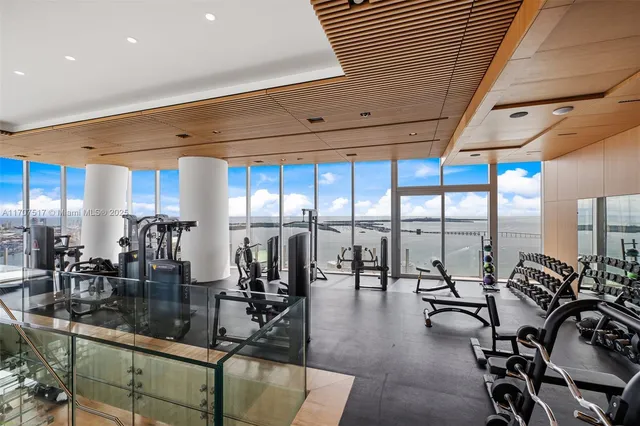 a view of a living room and bedroom