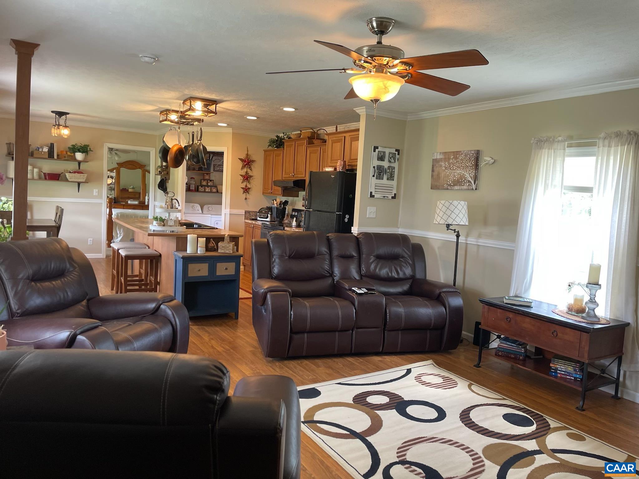 1619 South Constitution Route Dillwyn, VA 23936 - Photo 18 of 36 a living room with furniture and a chandelier