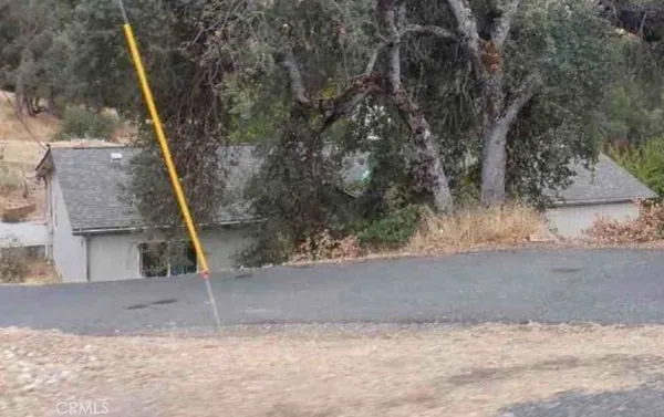 a view of a house with a tree