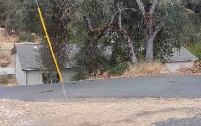 a view of a house with a tree