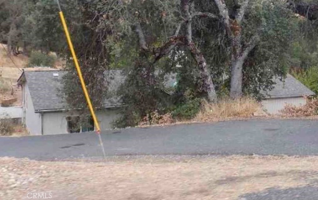 a view of a house with a tree