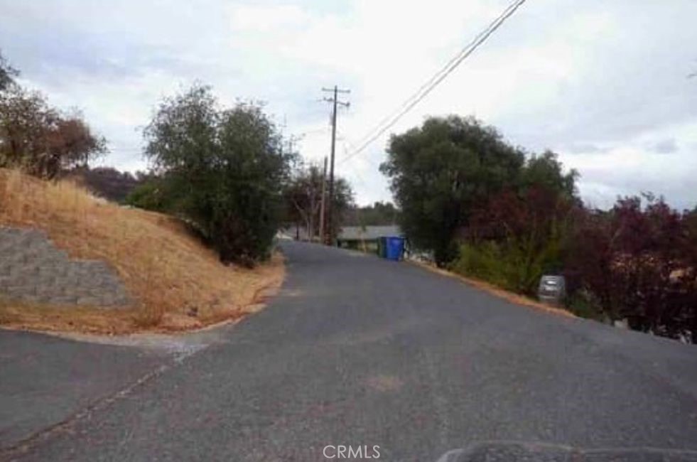 3735 Juniper Drive Angels Camp, CA 95222 - Photo 2 of 3 a view of a road with a building in the background