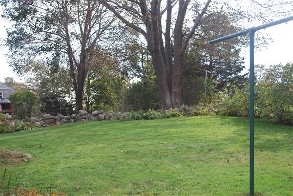 8 Warwick Road Gloucester, MA 01930 - Photo 11 of 11 a view of a grassy field with trees