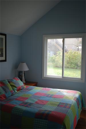 8 Warwick Road Gloucester, MA 01930 - Photo 6 of 11 a bedroom with a bed and a window