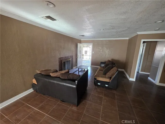 a living room with furniture and a mirror