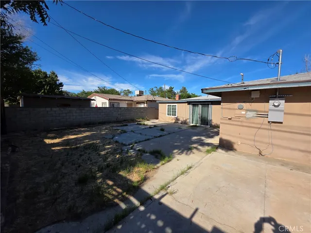 a view of a backyard of the house