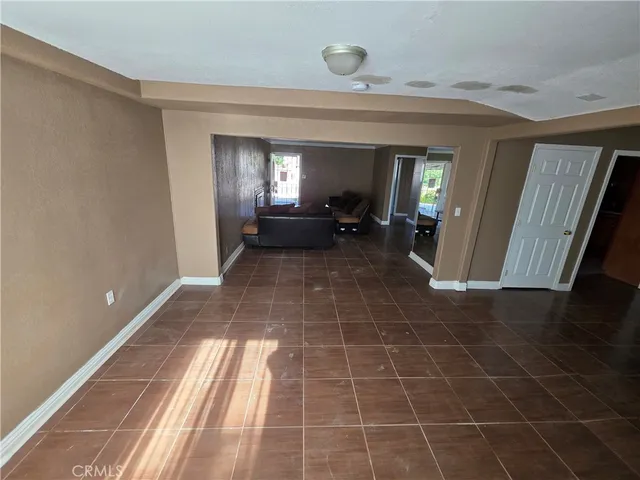 a view of a livingroom with furniture and staircase