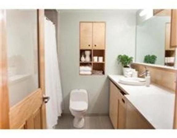 437 D Street, Unit 2C Boston, MA 02210 - Photo 12 of 13 a bathroom with a sink vanity granite and toilet