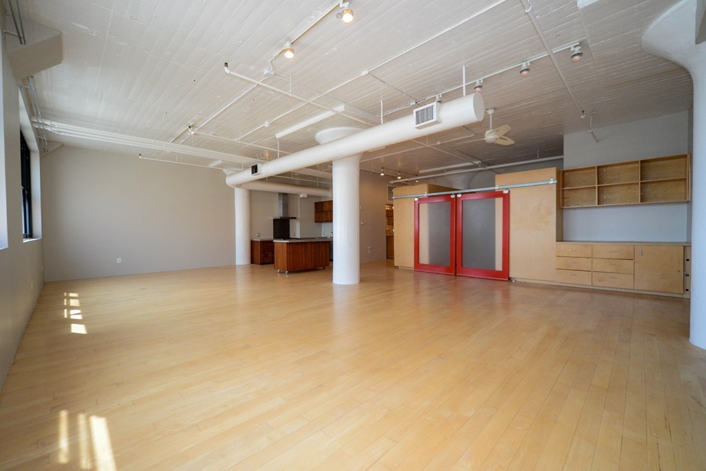 437 D Street, Unit 2C Boston, MA 02210 - Photo 5 of 13 a view of a room with gym equipment
