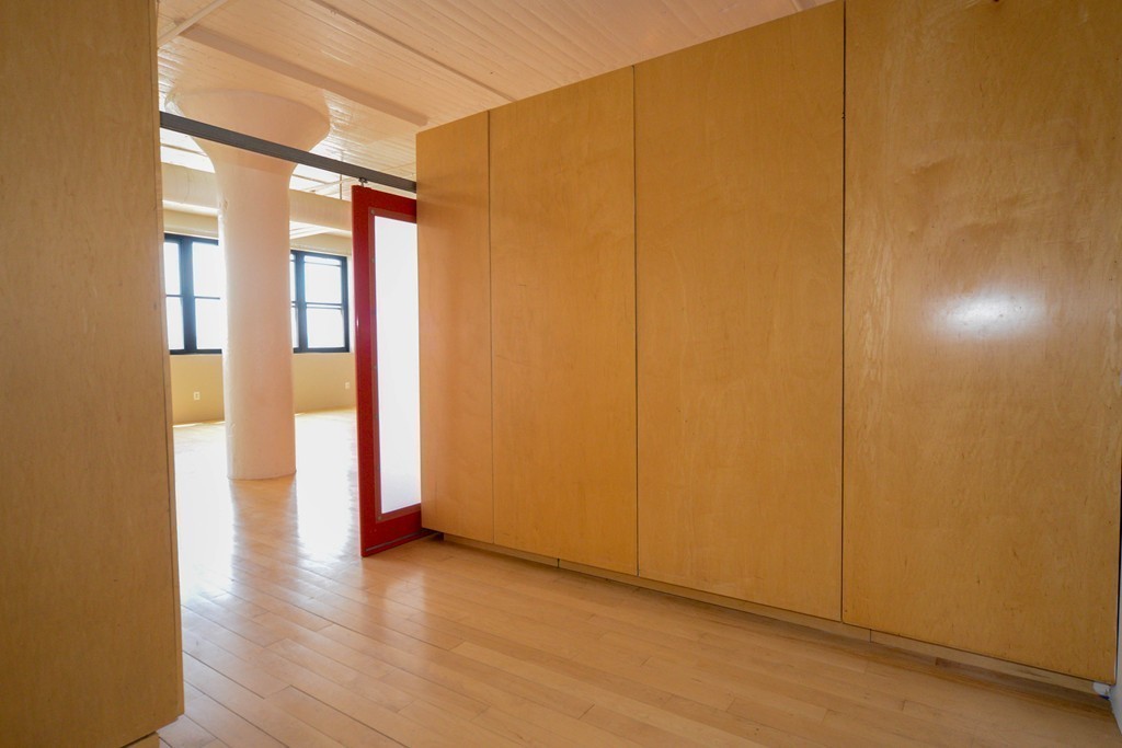 437 D Street, Unit 2C Boston, MA 02210 - Photo 7 of 13 a view of empty room with wooden floor