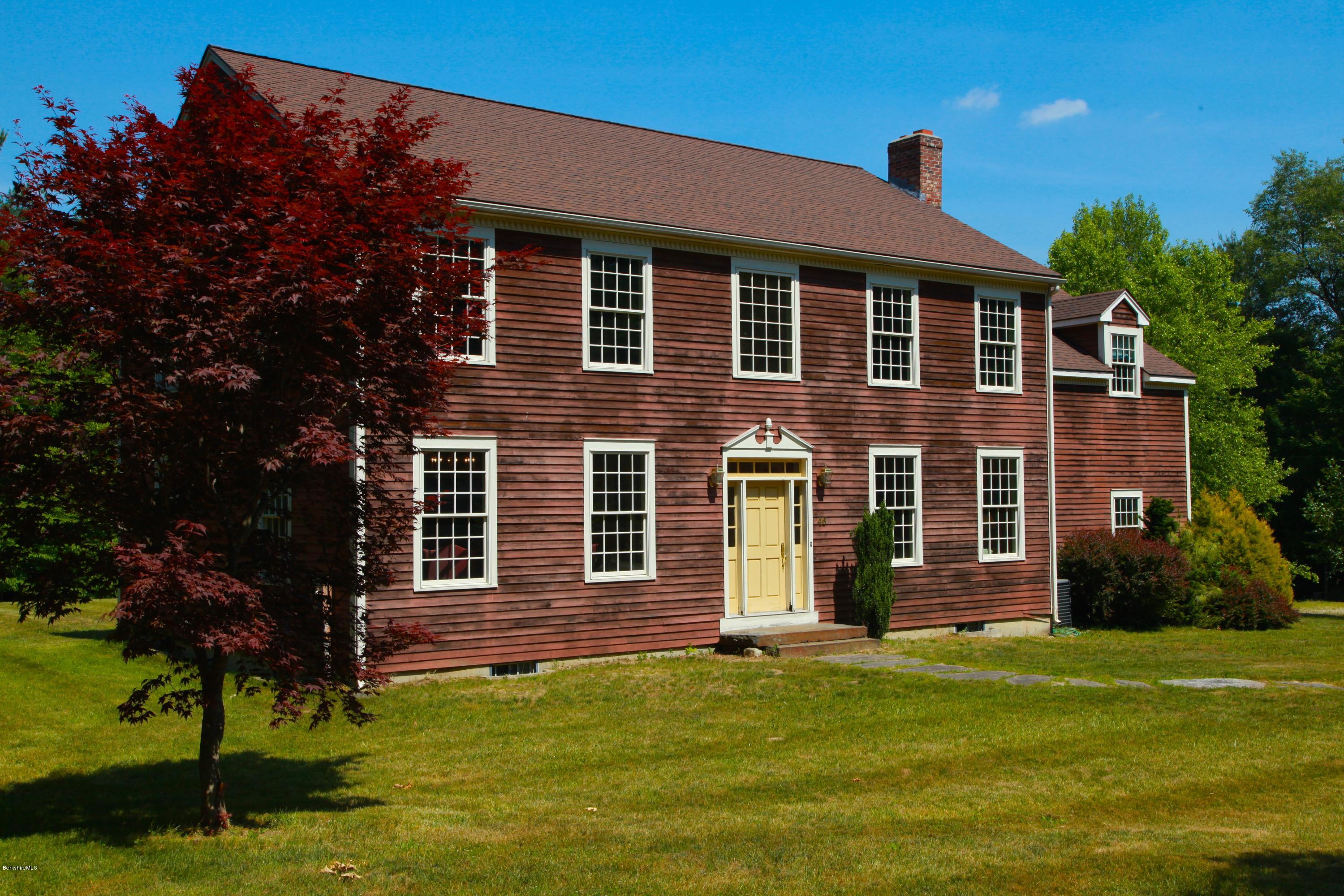 46 Stage Road Chesterfield, MA 01096 - Photo 2 of 34 a front view of a house with a garden