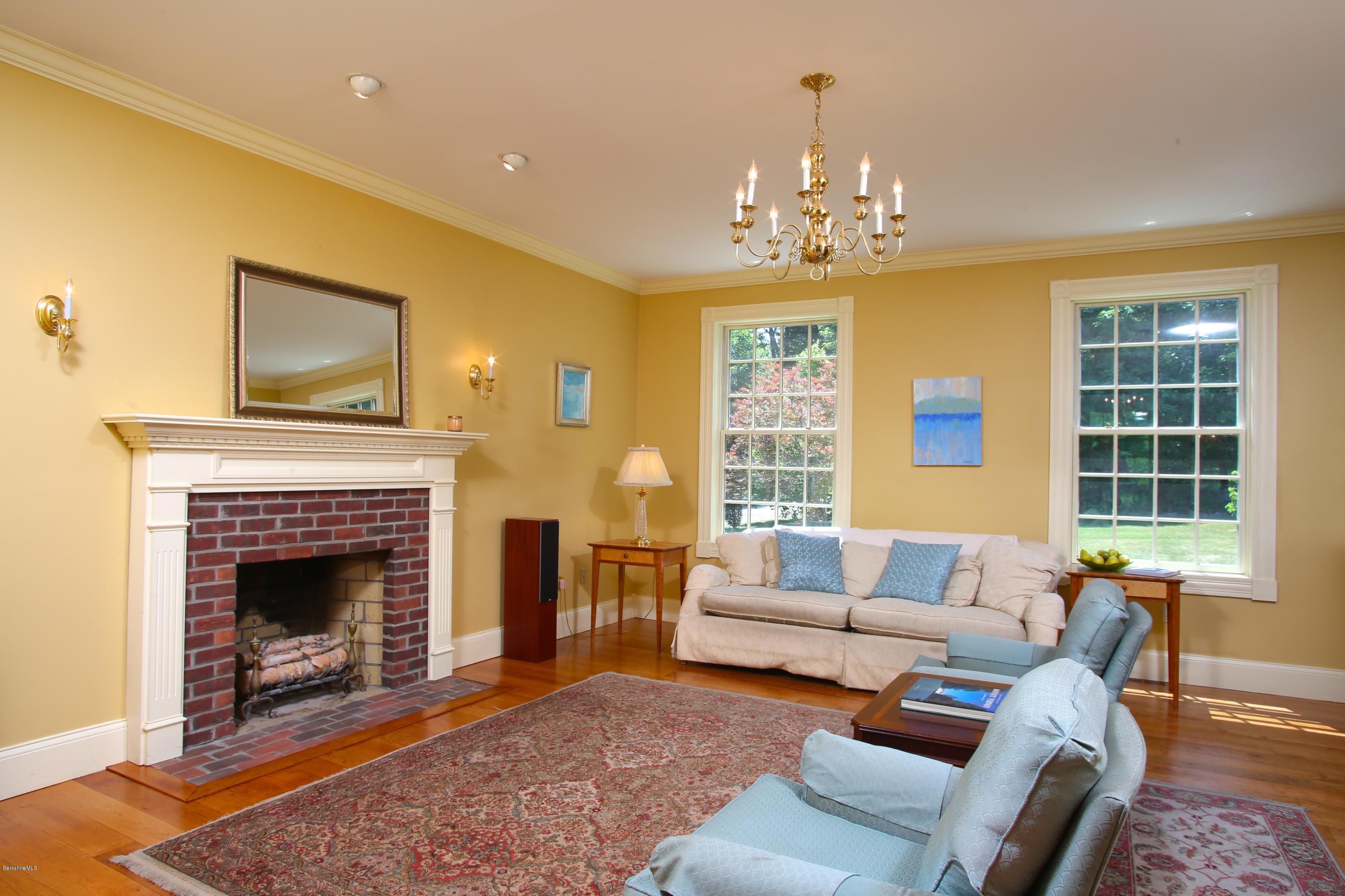 46 Stage Road Chesterfield, MA 01096 - Photo 15 of 34 a living room with furniture a fireplace and a chandelier