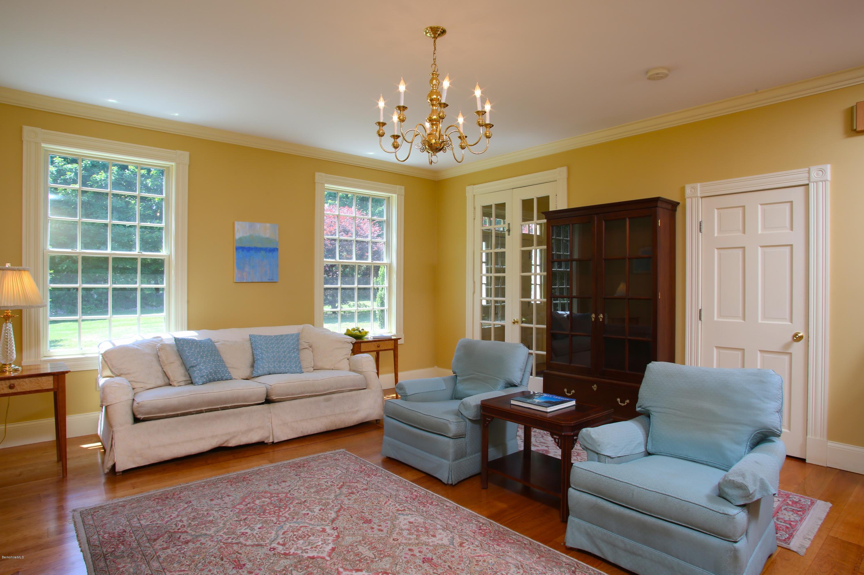46 Stage Road Chesterfield, MA 01096 - Photo 16 of 34 a living room with furniture and a chandelier