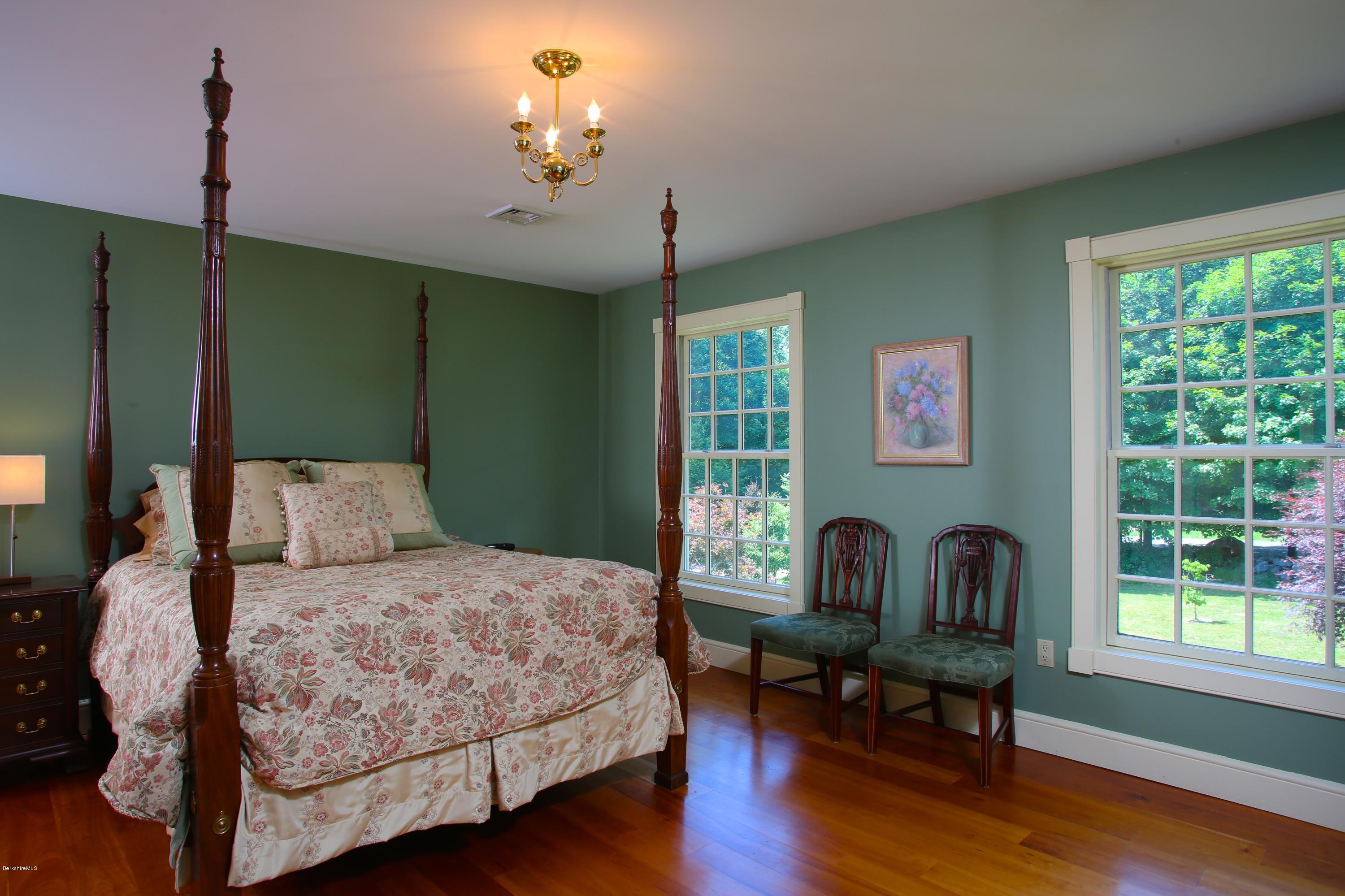 46 Stage Road Chesterfield, MA 01096 - Photo 21 of 34 a bedroom with a bed wooden floor and a window
