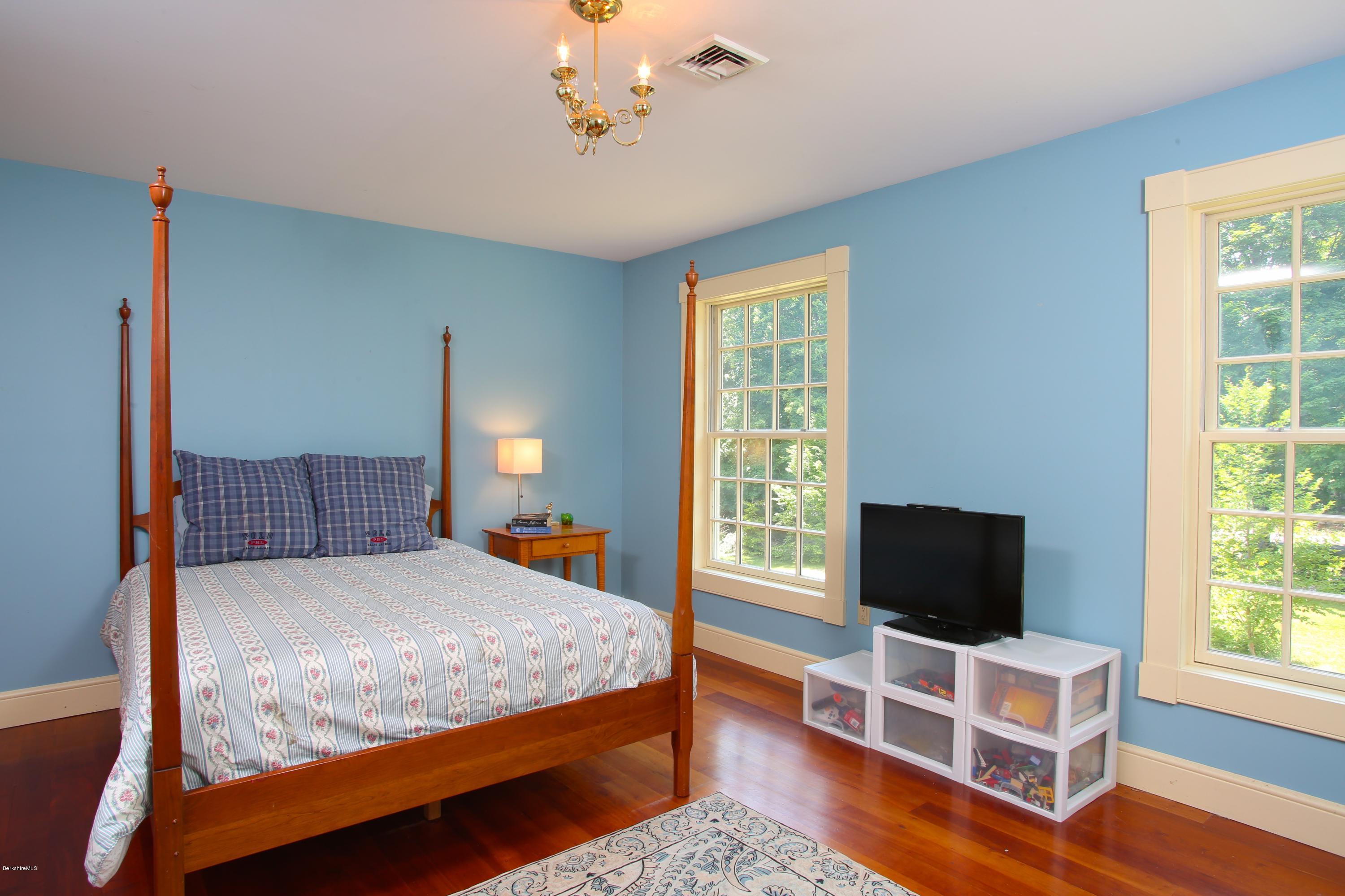 46 Stage Road Chesterfield, MA 01096 - Photo 24 of 34 a bedroom with a bed and wooden floor