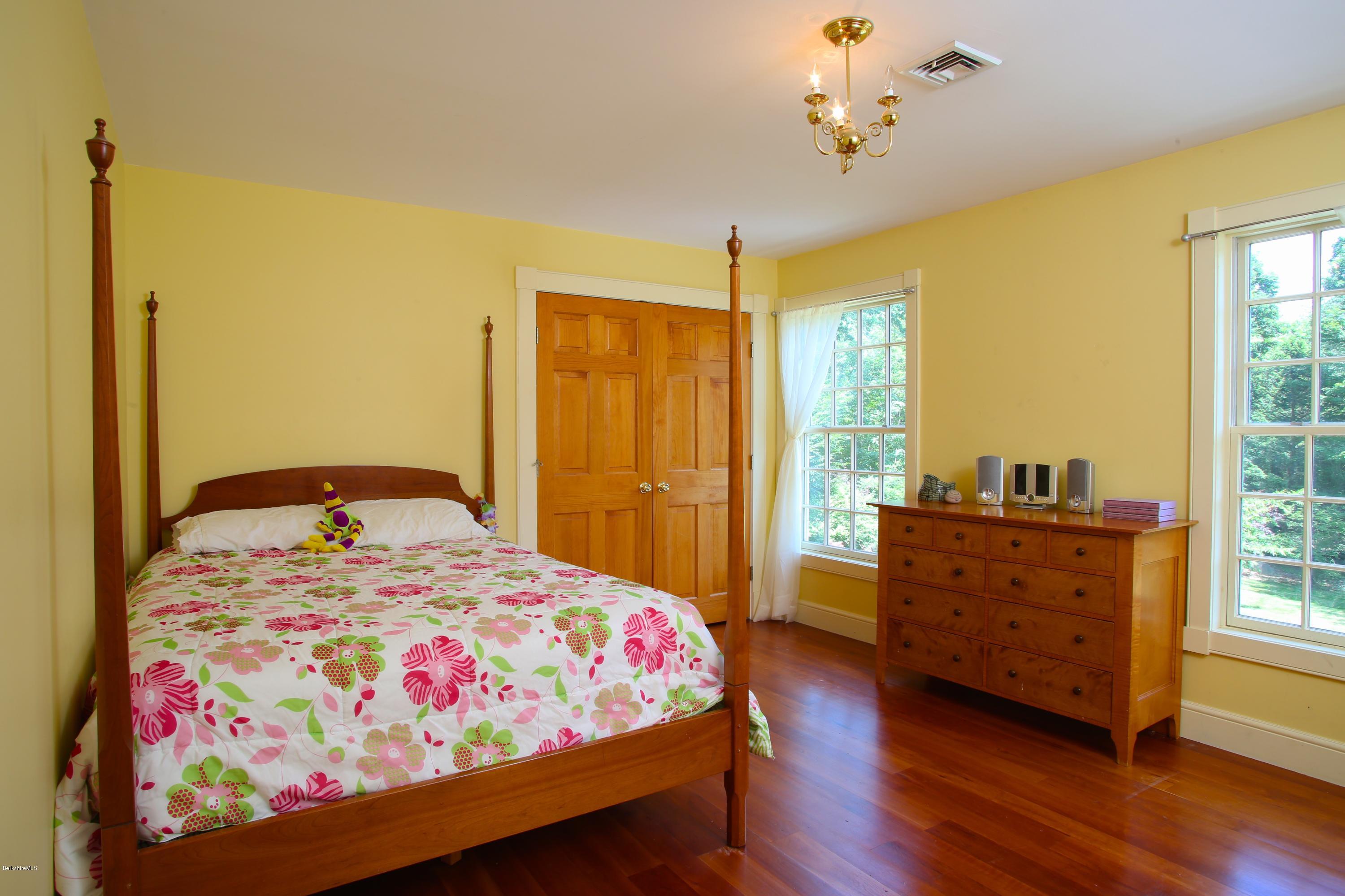 46 Stage Road Chesterfield, MA 01096 - Photo 25 of 34 a bedroom with a bed and wooden floor