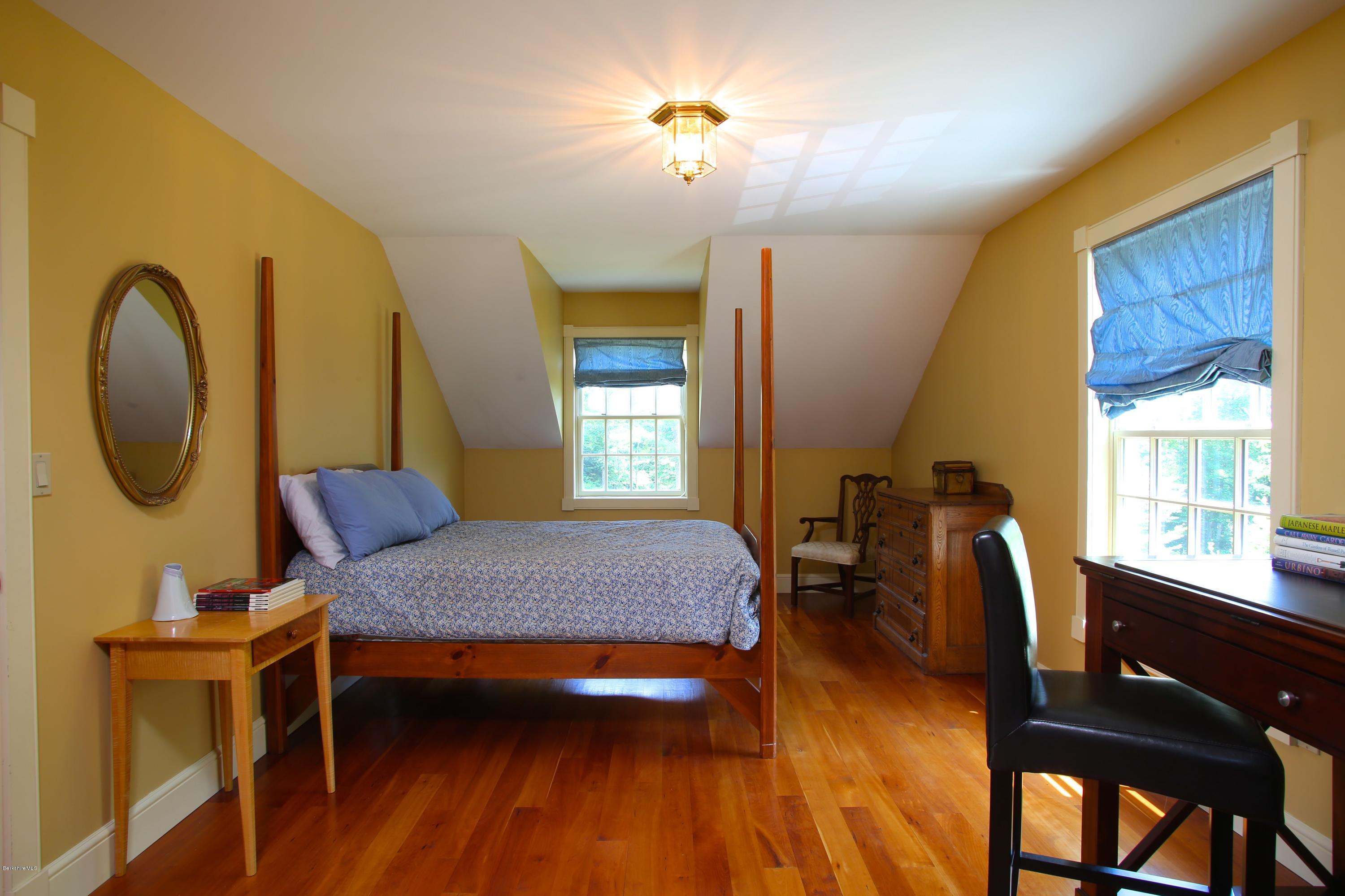 46 Stage Road Chesterfield, MA 01096 - Photo 28 of 34 a bedroom with a bed and wooden floor