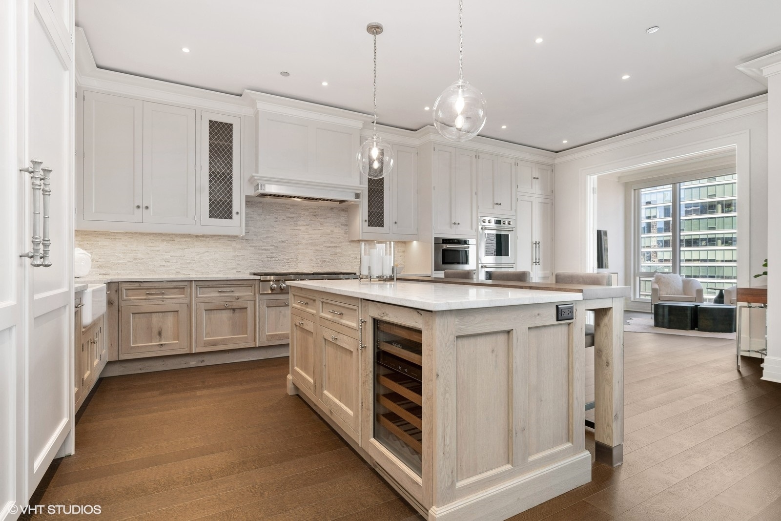 9 West Walton Street, Unit 1402 Chicago, IL 60610 - Photo 13 of 31 a kitchen with stainless steel appliances granite countertop a stove a sink dishwasher a refrigerator and white cabinets with wooden floor