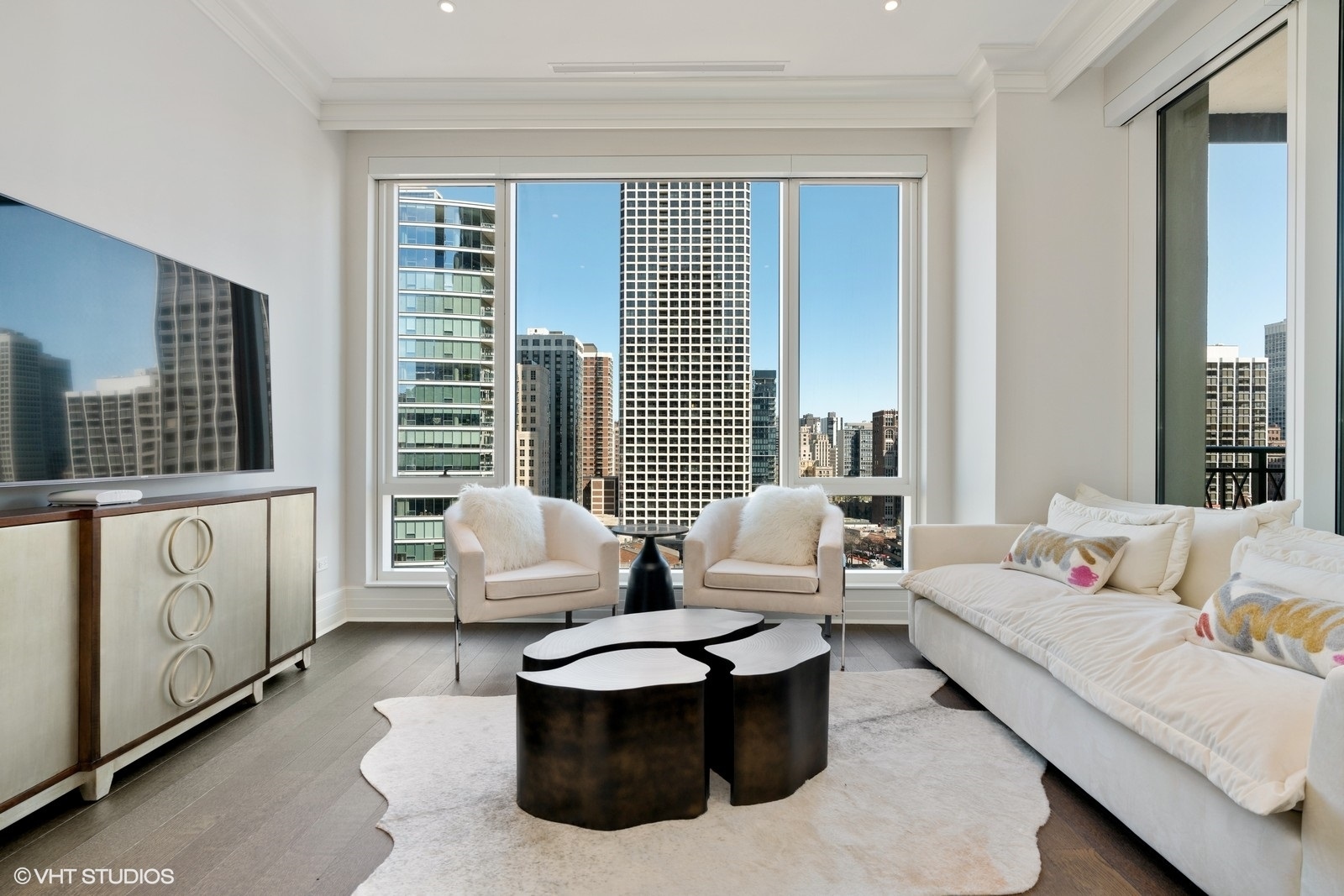 9 West Walton Street, Unit 1402 Chicago, IL 60610 - Photo 14 of 31 a living room with furniture and a large window