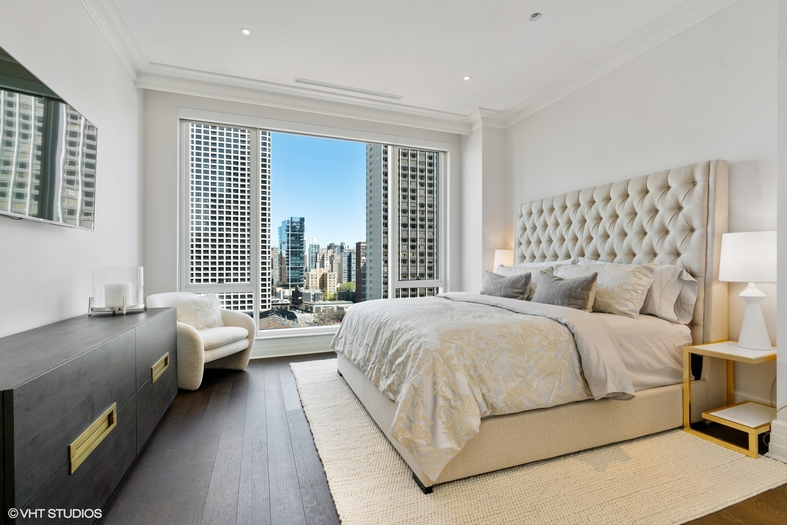 9 West Walton Street, Unit 1402 Chicago, IL 60610 - Photo 15 of 31 a bedroom with a bed and a couch