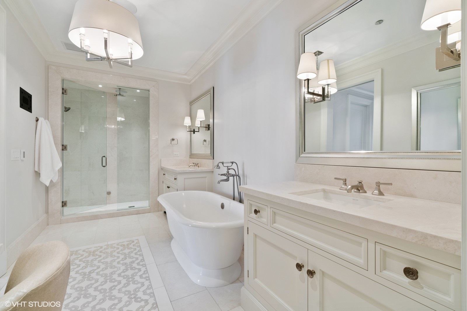 9 West Walton Street, Unit 1402 Chicago, IL 60610 - Photo 17 of 31 a bathroom with a double vanity sink mirror and shower