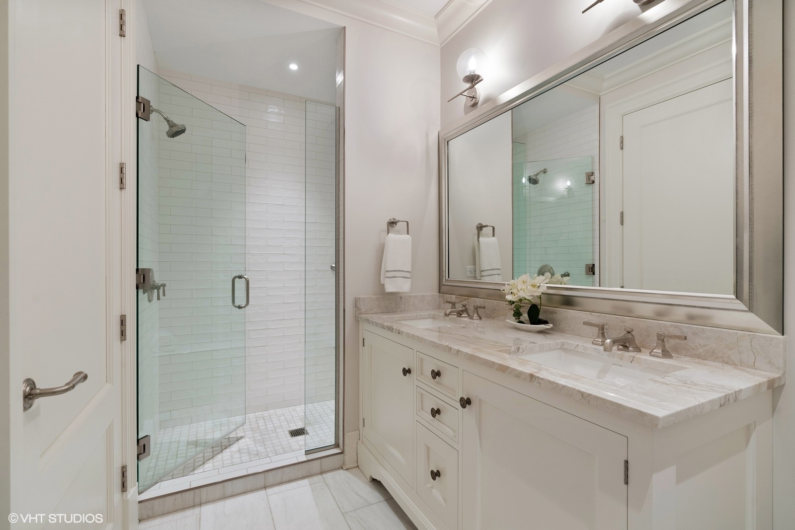 9 West Walton Street, Unit 1402 Chicago, IL 60610 - Photo 20 of 31 a bathroom with a shower sink vanity granite and mirror