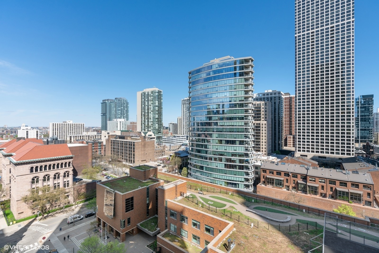 9 West Walton Street, Unit 1402 Chicago, IL 60610 - Photo 24 of 31 a view of a city with tall buildings