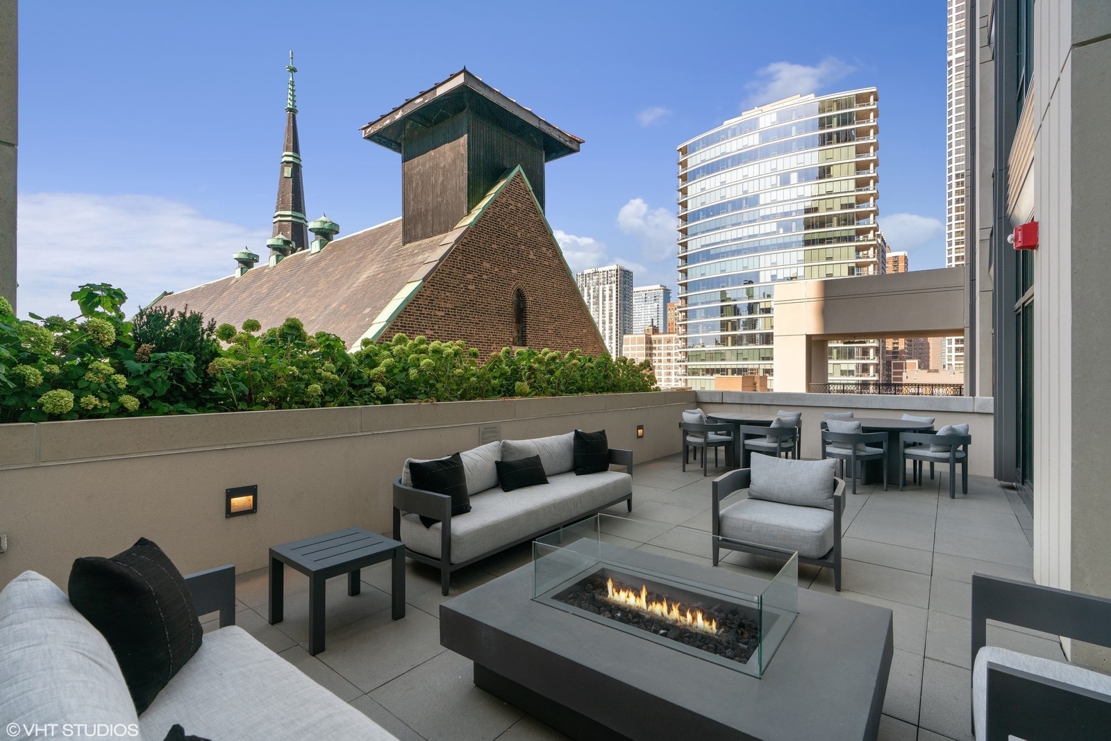 9 West Walton Street, Unit 1402 Chicago, IL 60610 - Photo 31 of 31 a outdoor space with patio the couches and a potted plant on a table