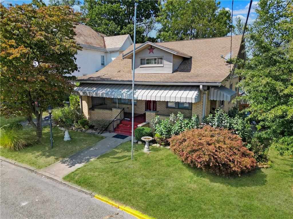 a front view of house with garden