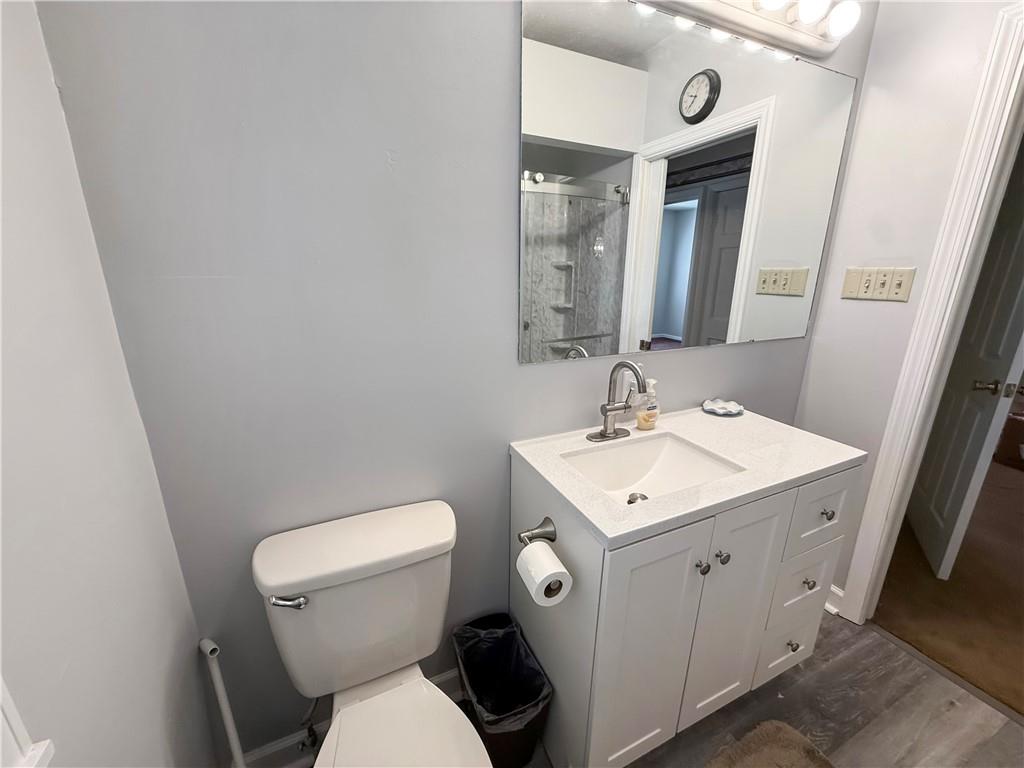 450 Clay Street Rochester, PA 15074 - Photo 11 of 34 a bathroom with a toilet sink and mirror