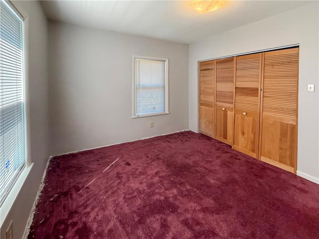 450 Clay Street Rochester, PA 15074 - Photo 13 of 34 a view of a room with a large bed and wooden floor